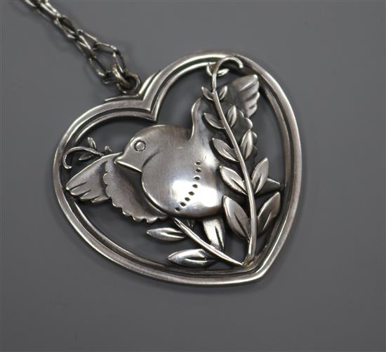 A Danish Georg Jensen sterling silver heart shaped bird brooch, no. 97, brooch 40mm.